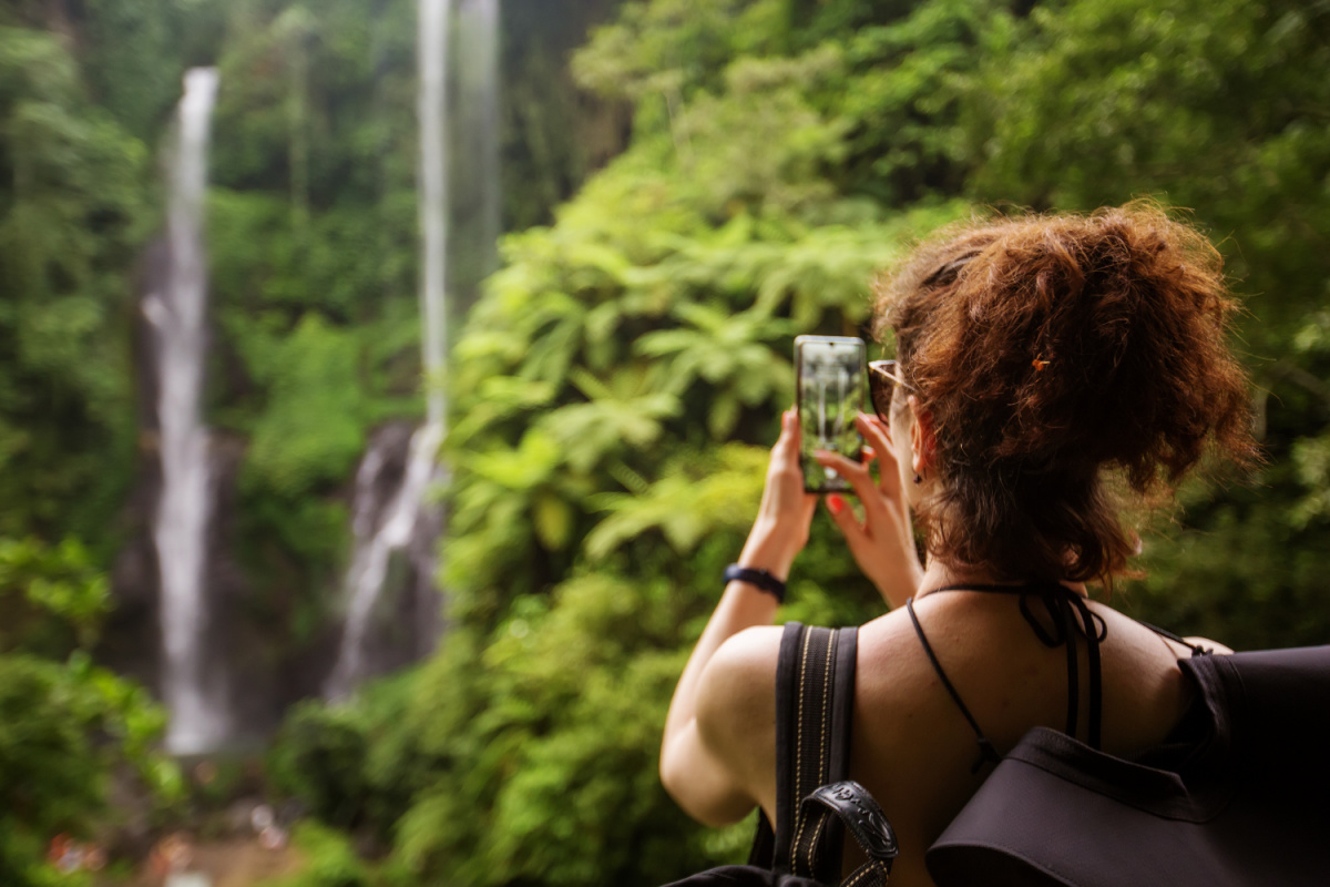 Woman TAkes Photo of Bali Waterfall.jpg