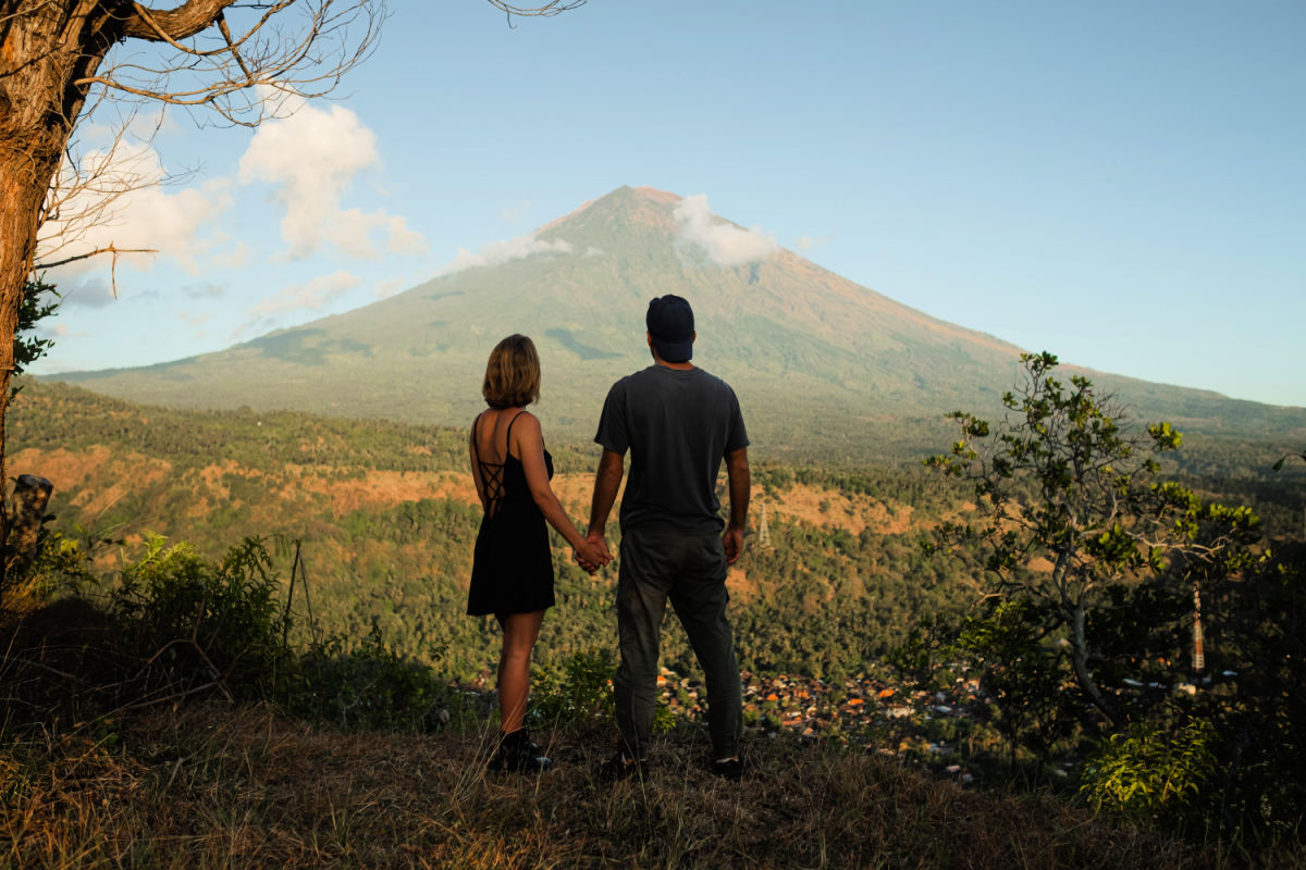 Couple Hold Hands Looking at Mount Agung in Bali.jpg