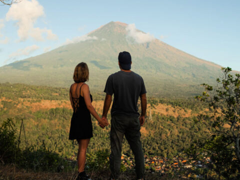 Couple-Hold-Hands-Looking-at-Mount-Agung-in-Bali