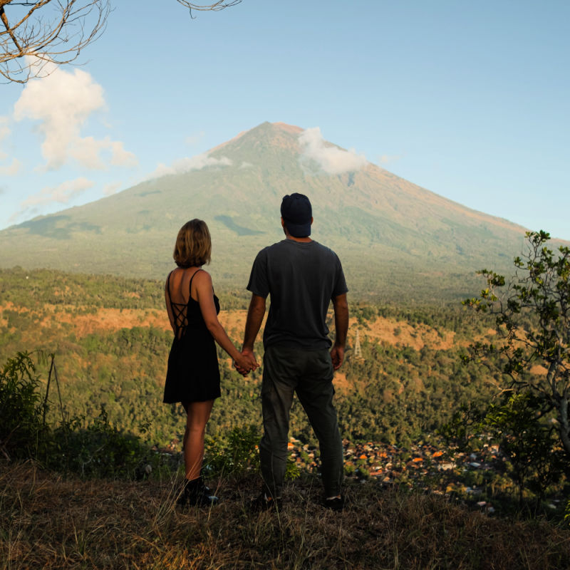 Couple-Hold-Hands-Looking-at-Mount-Agung-in-Bali