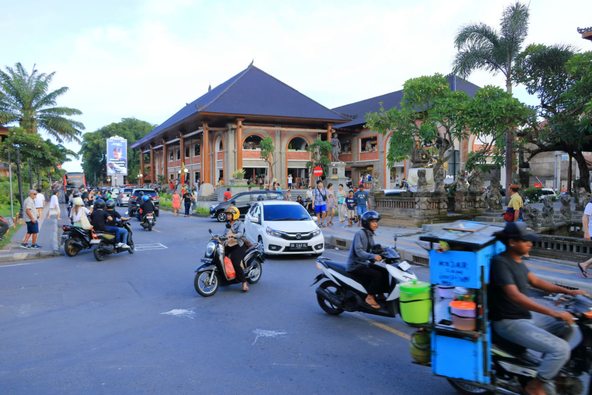 Drivers on Motorcyles and Cars in Central Ubud Bali.jpg