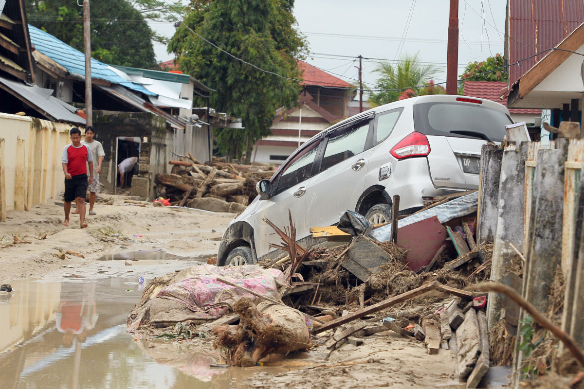 Car Washed Up In Flood Water.jpg