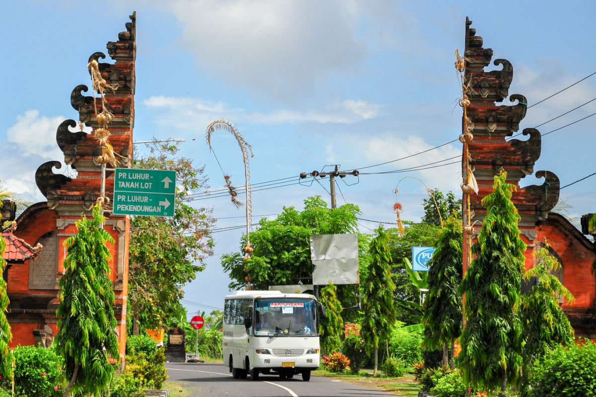 Bus Drives through Bali Gates.jpg