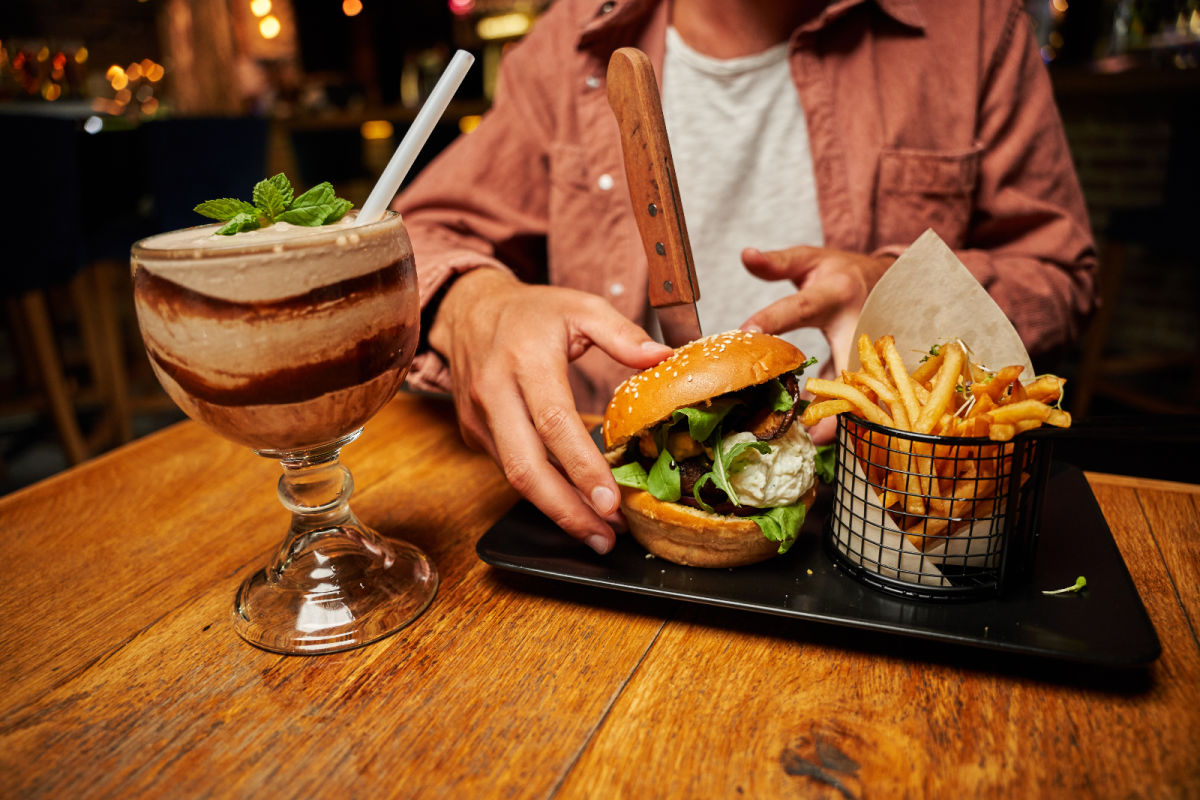 Man Eats Burger and Chips Food Pub Bali.jpg