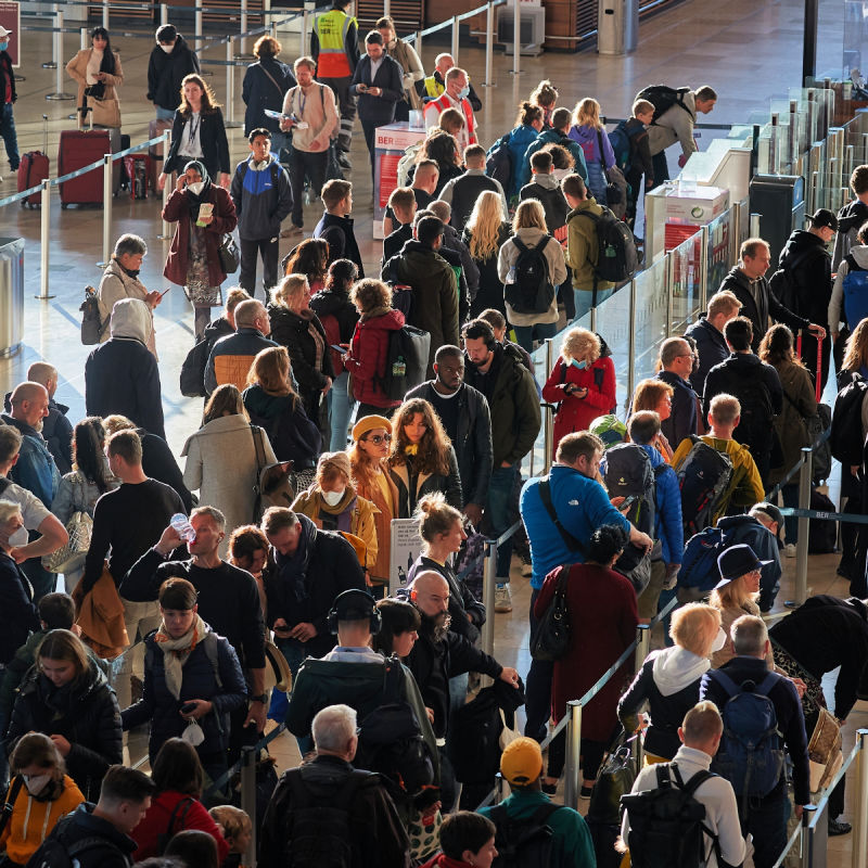 Queue of tourists at airport.jpg