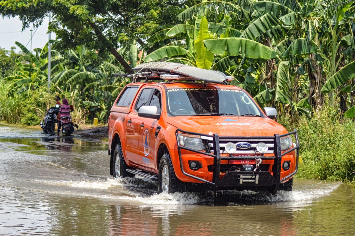 Disaster Management Agency Truck Drives Through Flood Water in Bali.jpg