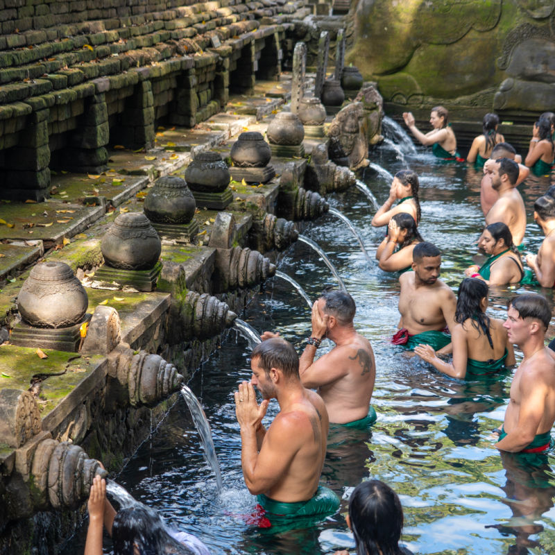 Tourists-Take-Part-In-Melukat-Water-Blessing-Ceremony-At-Tirta-Empul-Bali