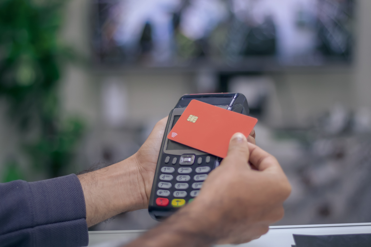 Man Uses Card Reader for Payment Money.jpg