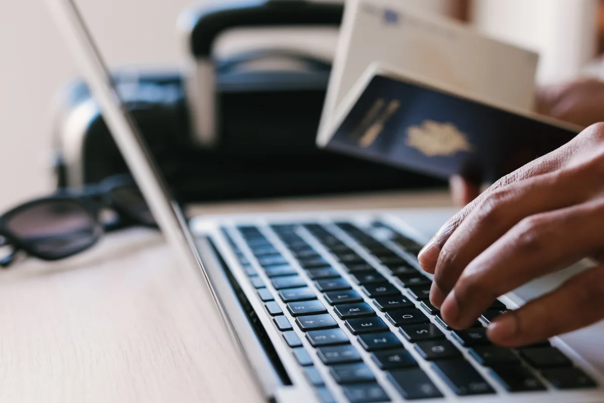Passport Laptop Keyboard Hands.jpg
