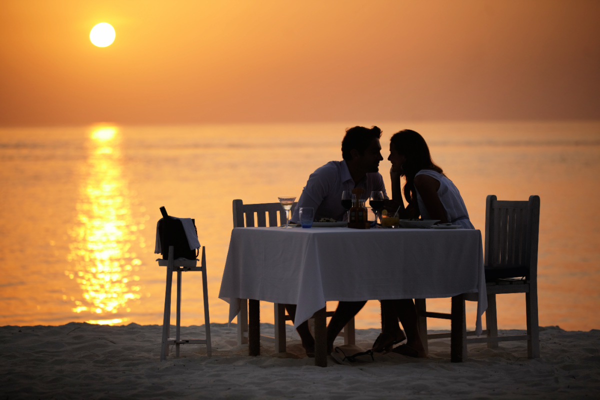 Couple Have Romantic Dinner On Bali Beach Sunset.jpg