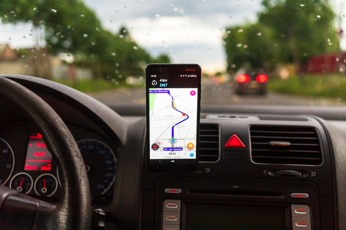 Driver in Car Uses App Maps.jpg