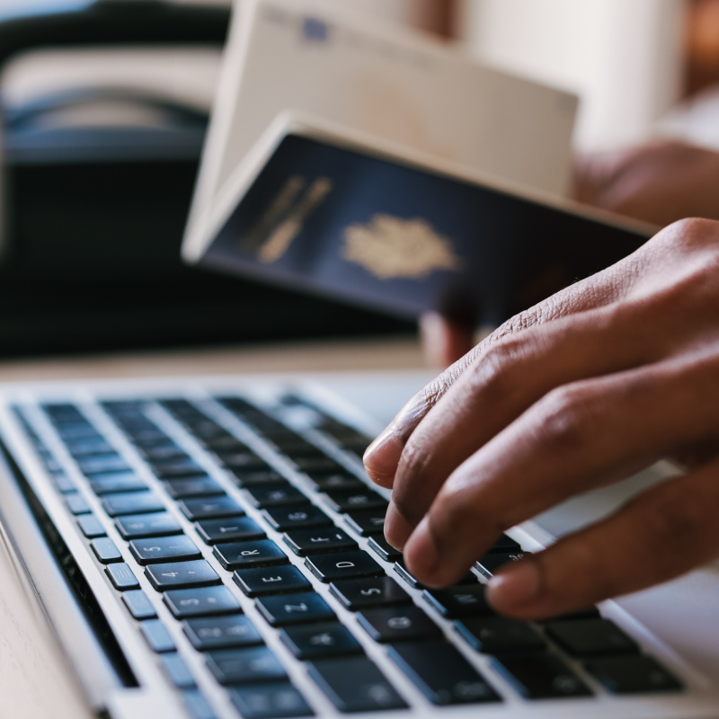 Passport Laptop Keyboard Hands