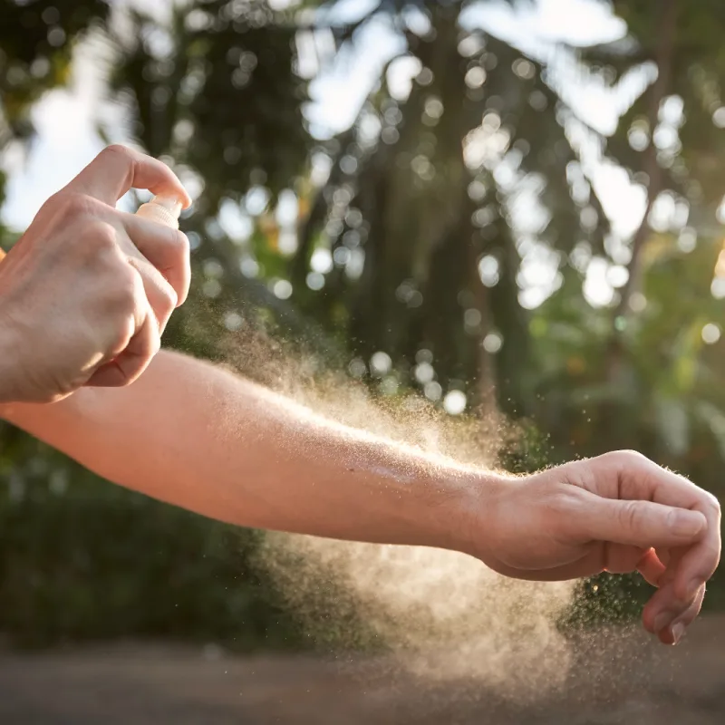 Spray Mosqutio Repellent On Arm.jpg