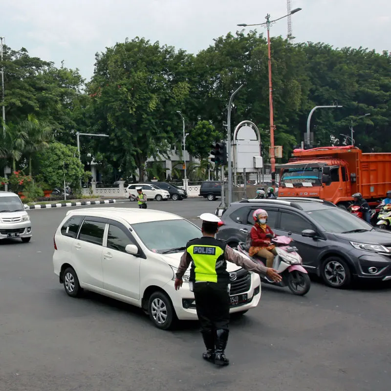 Traffic-Police-Officers-Direct-Traffic-On-Road-In-Bali