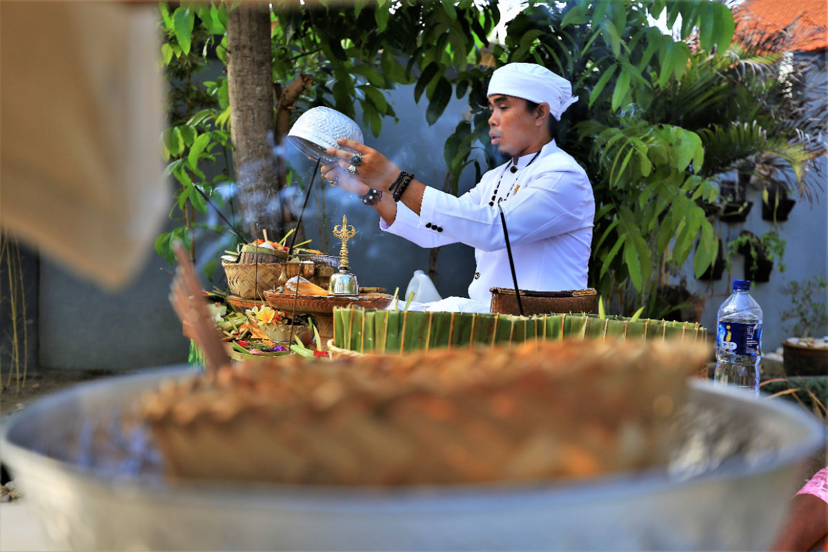 Mangku Priest Conducts Bali Ceremony .jpg