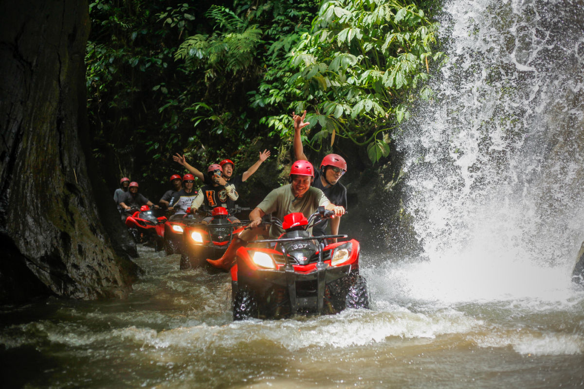 Tourists in Bali Drive ATV in River Jungle Ubud.jpg