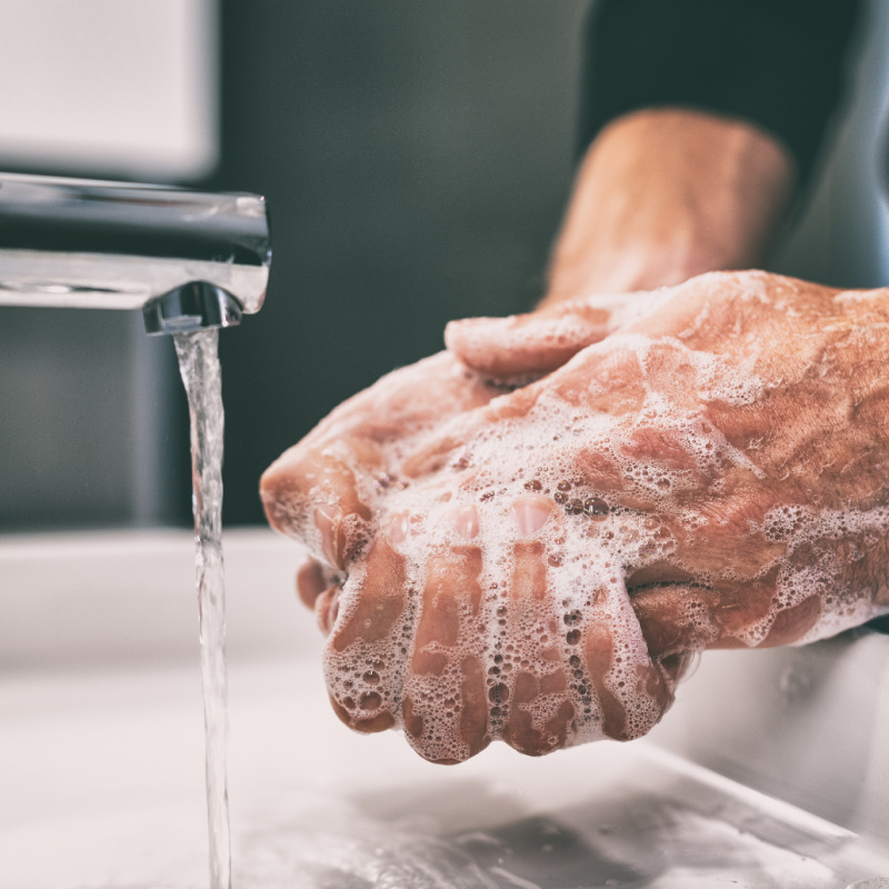 Man Washes Hands Under Sink Tap Water in Bali