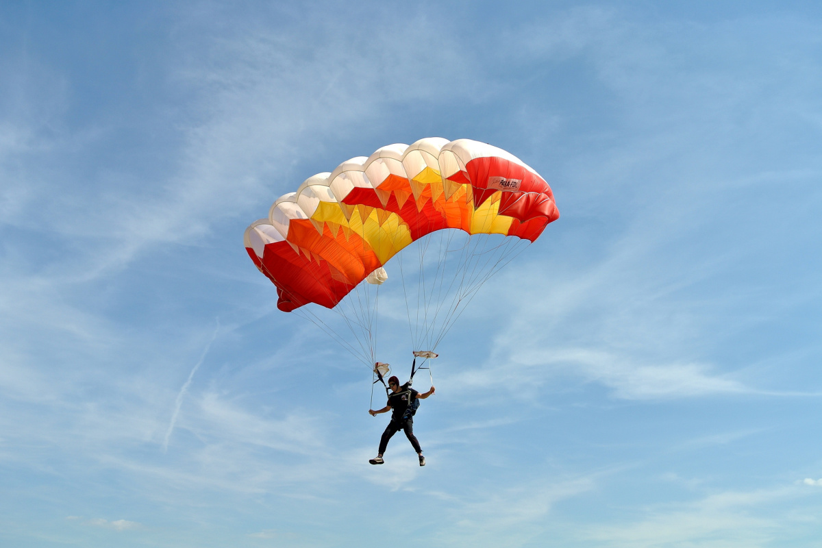 Skydive Skydiver in Bali with Orange Parachute.jpg