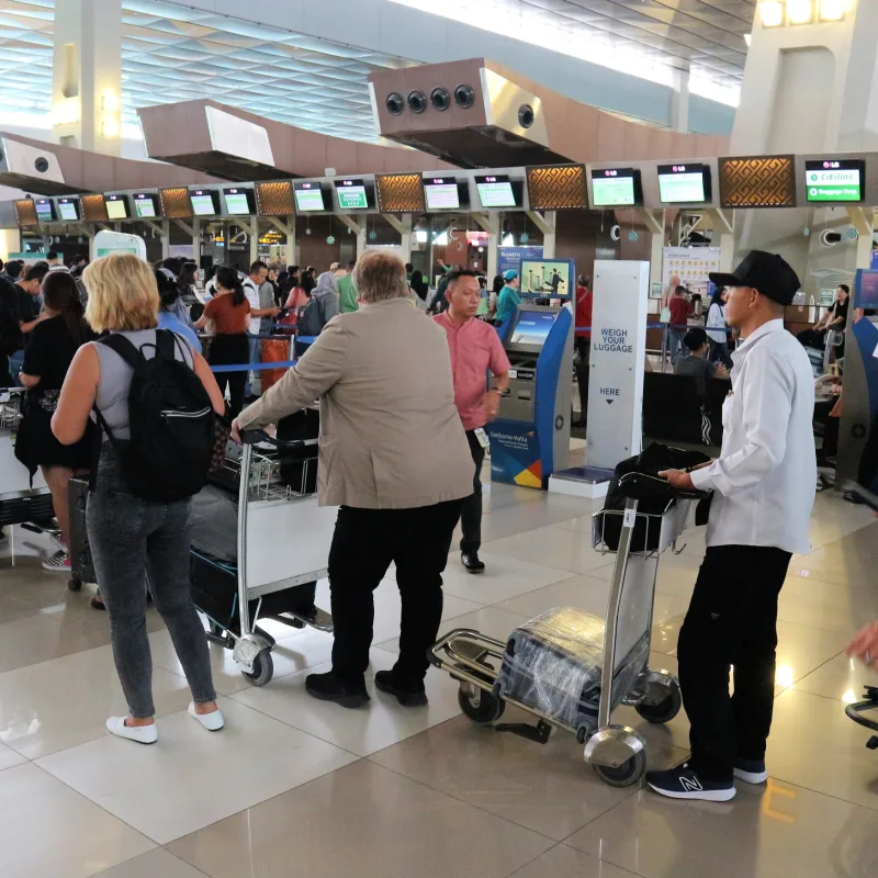 Travelers Queue At Airport