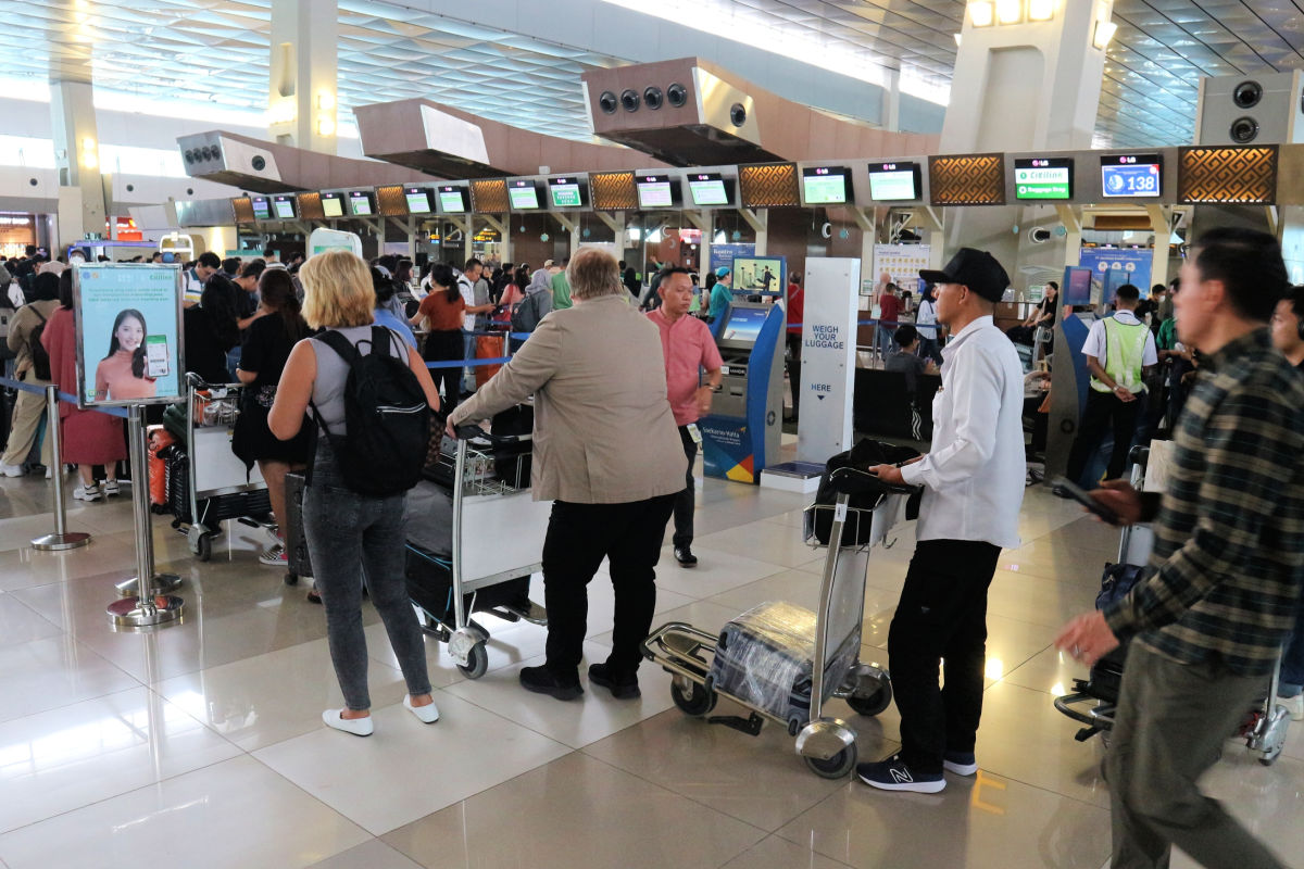 Travelers Queue At Airport.jpg