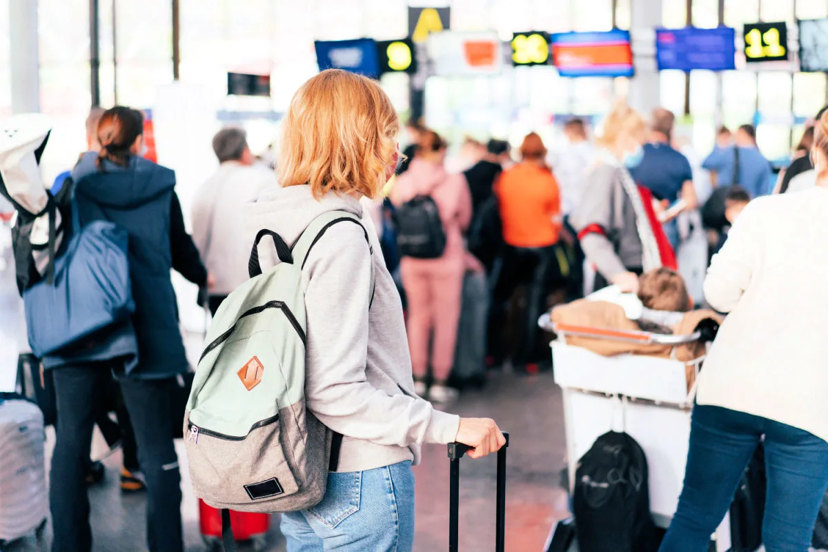 Woman In Immigration Airport Check in Queue.jpg