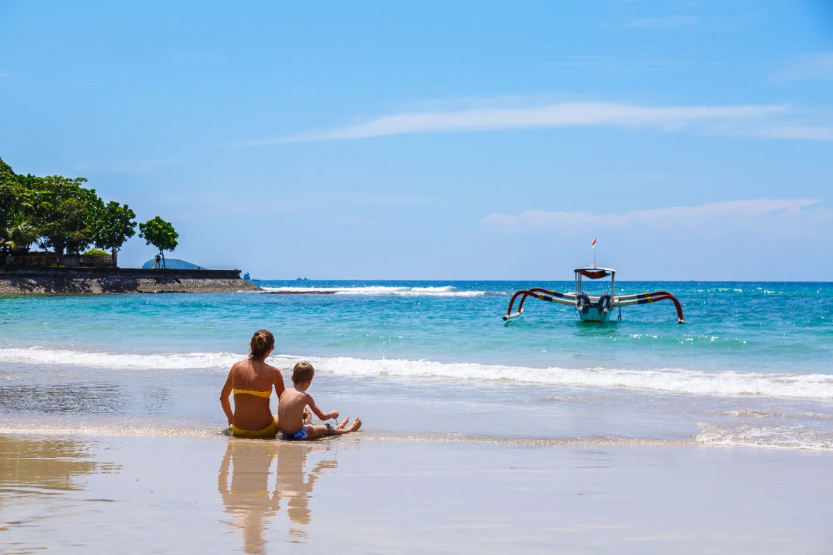 Woman and Boy Sit on Bali Beach.jpg