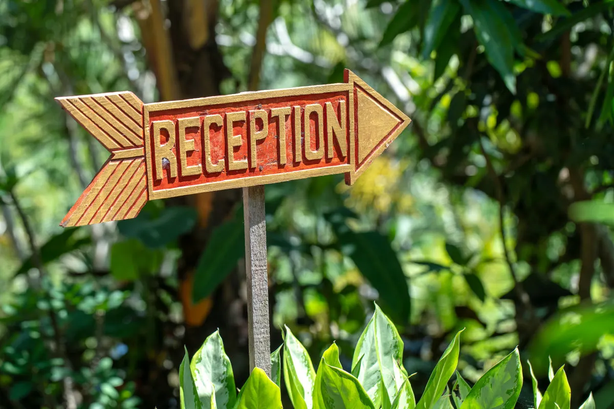 Reception Sign At Bali Hotel Guesthouse.jpg
