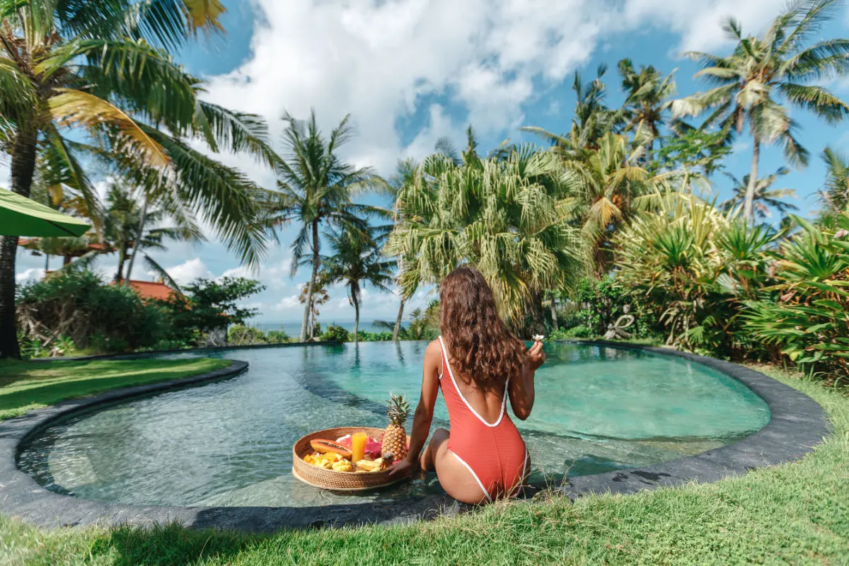 Woman by Pool in Bali Beauty Wellness Luxuty.jpg