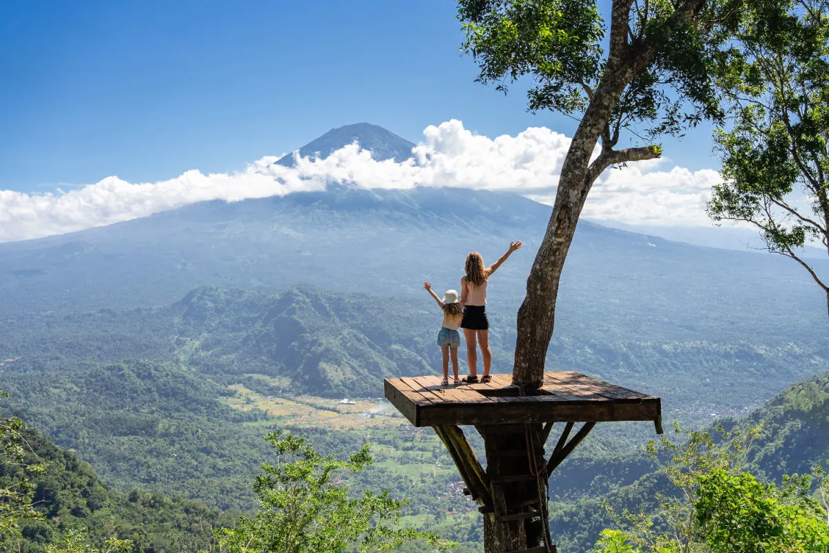 Tourists Mum and Daughter Family Look at Mount Agung in Bali.jpg
