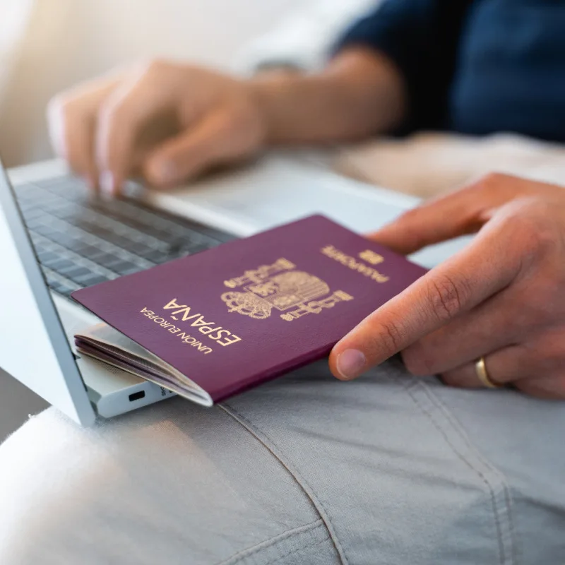 Passport And Laptop Close Up