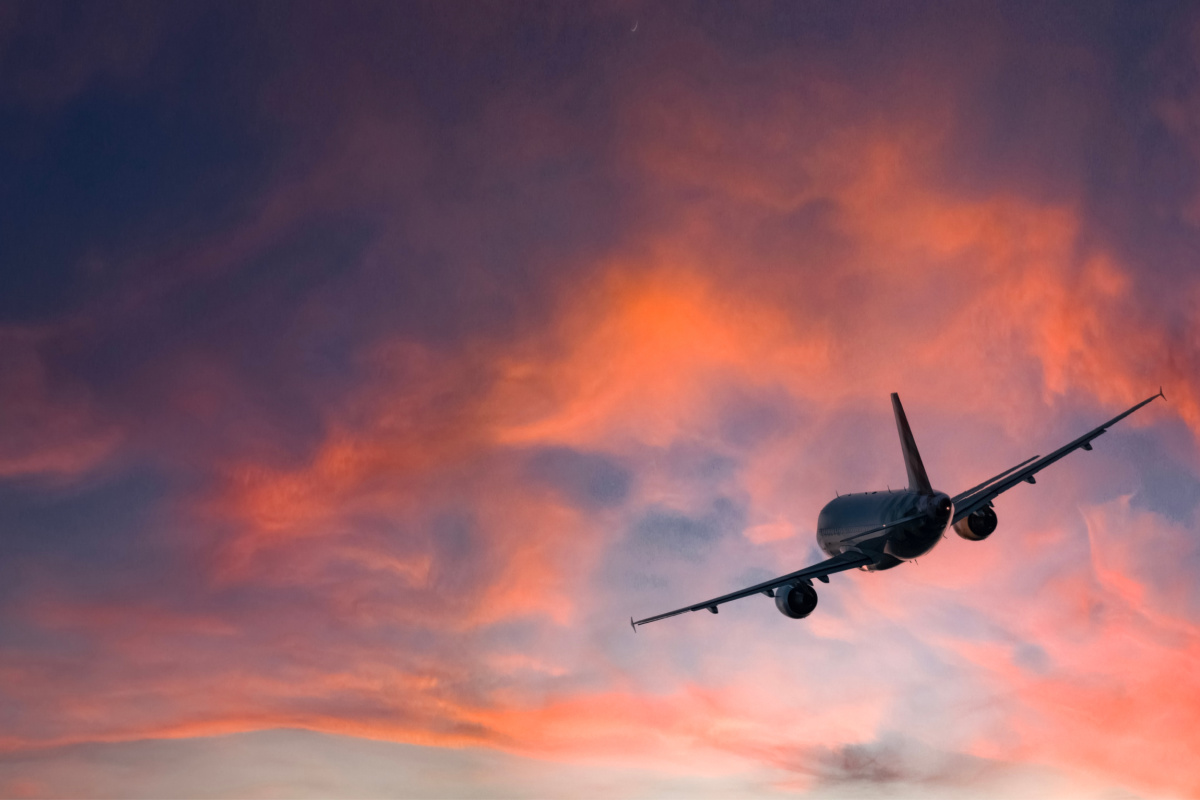 Plane Takes Off At Sunset Bali.jpg