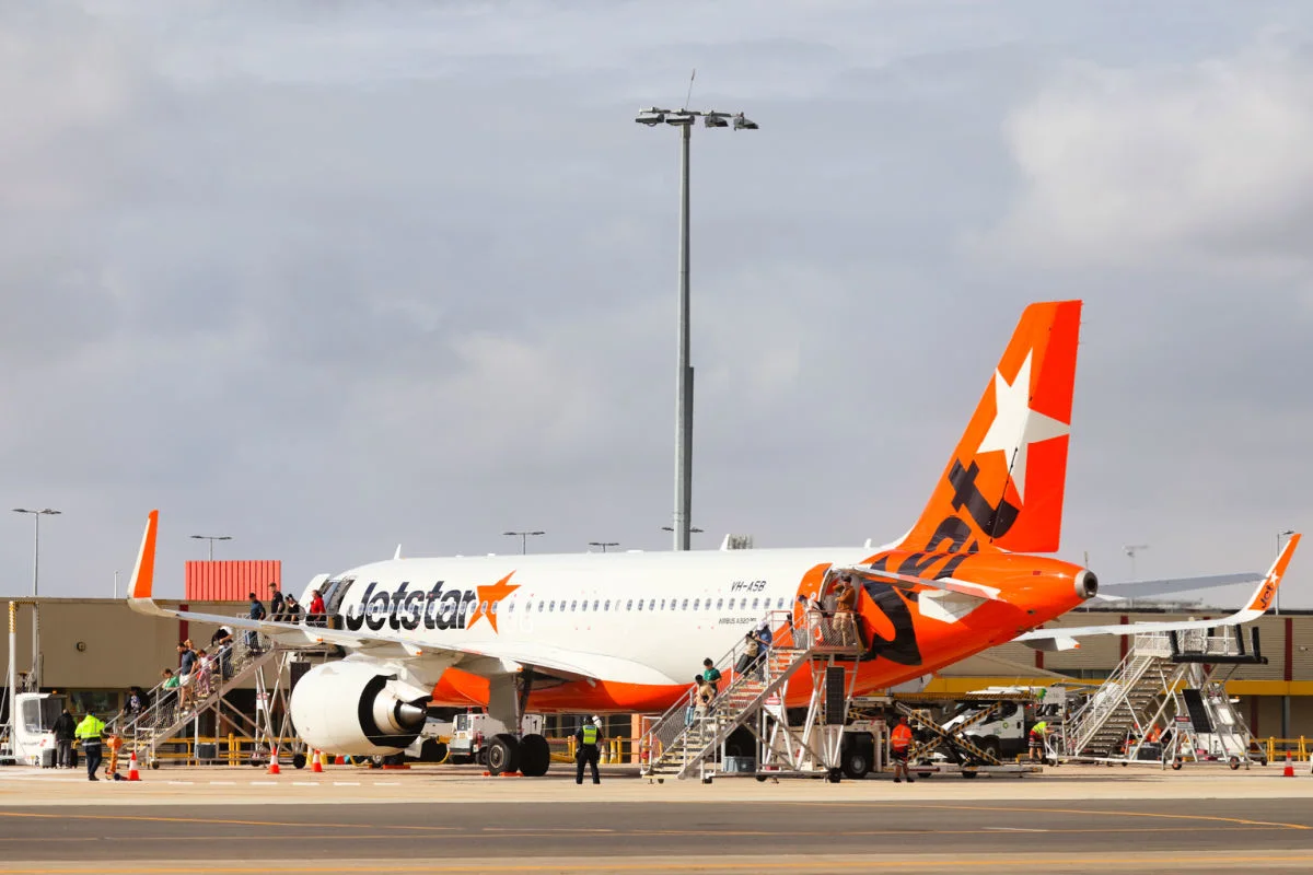 Jetstar Plane on Runway at Airport.jpg