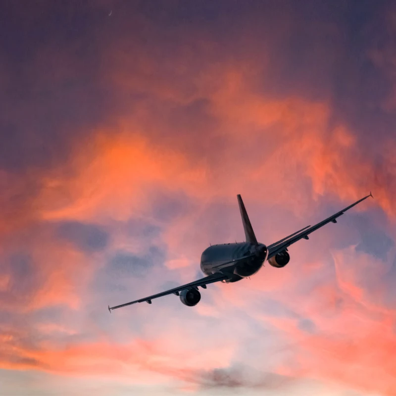 Plane Takes Off At Sunset Bali.jpg