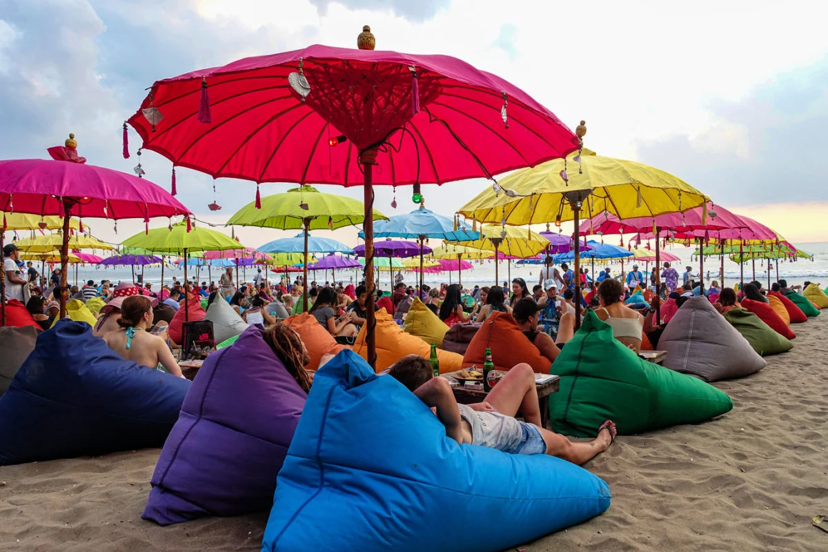 Beach Bean Bags and Umbrellas on Busy Seminyak beach in Bali