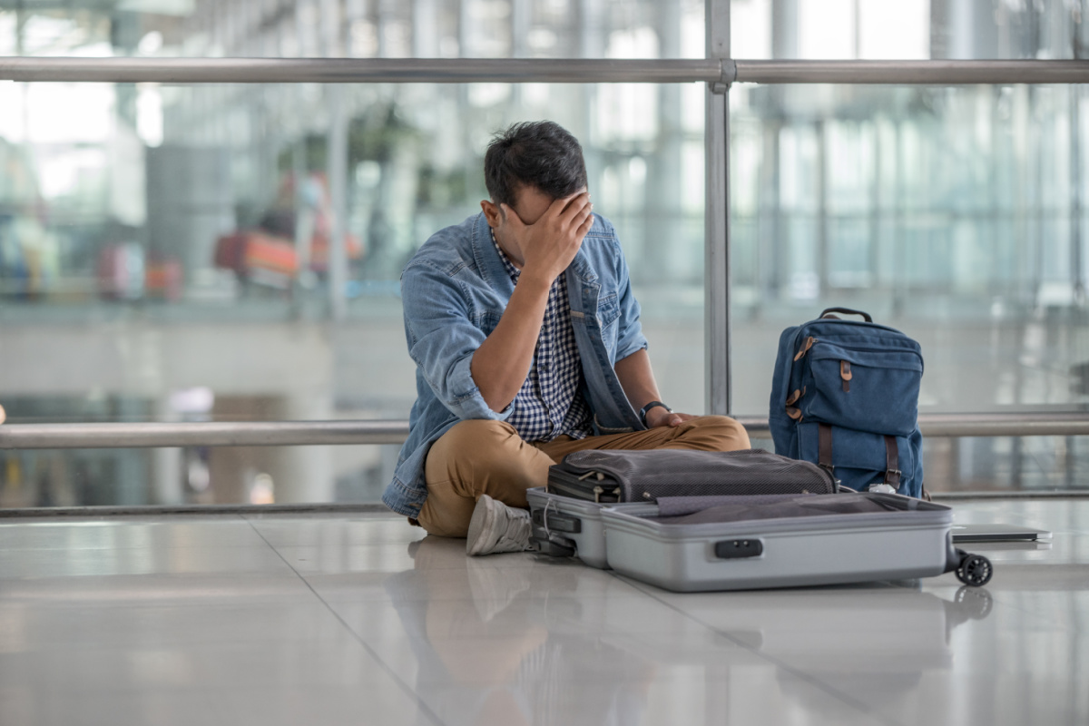 Man Looks Distressed At Airport.jpg