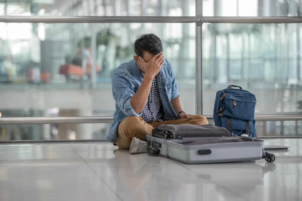 Man Looks Distressed At Airport.jpg