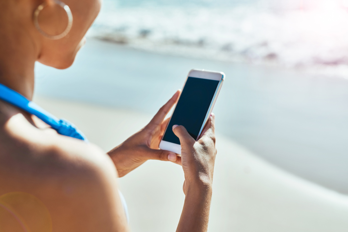 Woman on Phone on Beach in Bali.jpg
