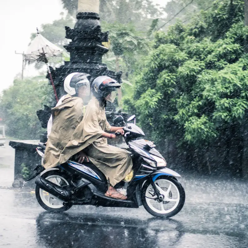 Two People on Moped in Rain in Bali