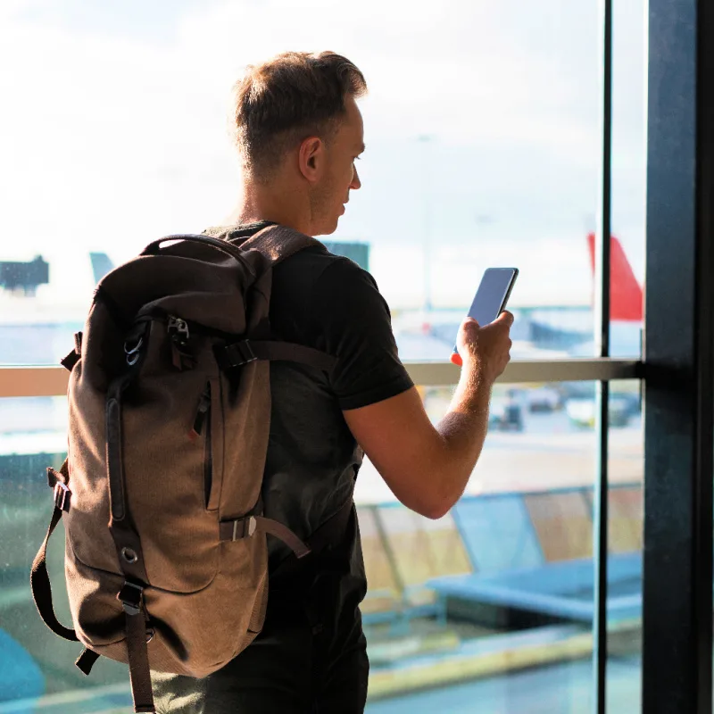 Man on Phone at Airport
