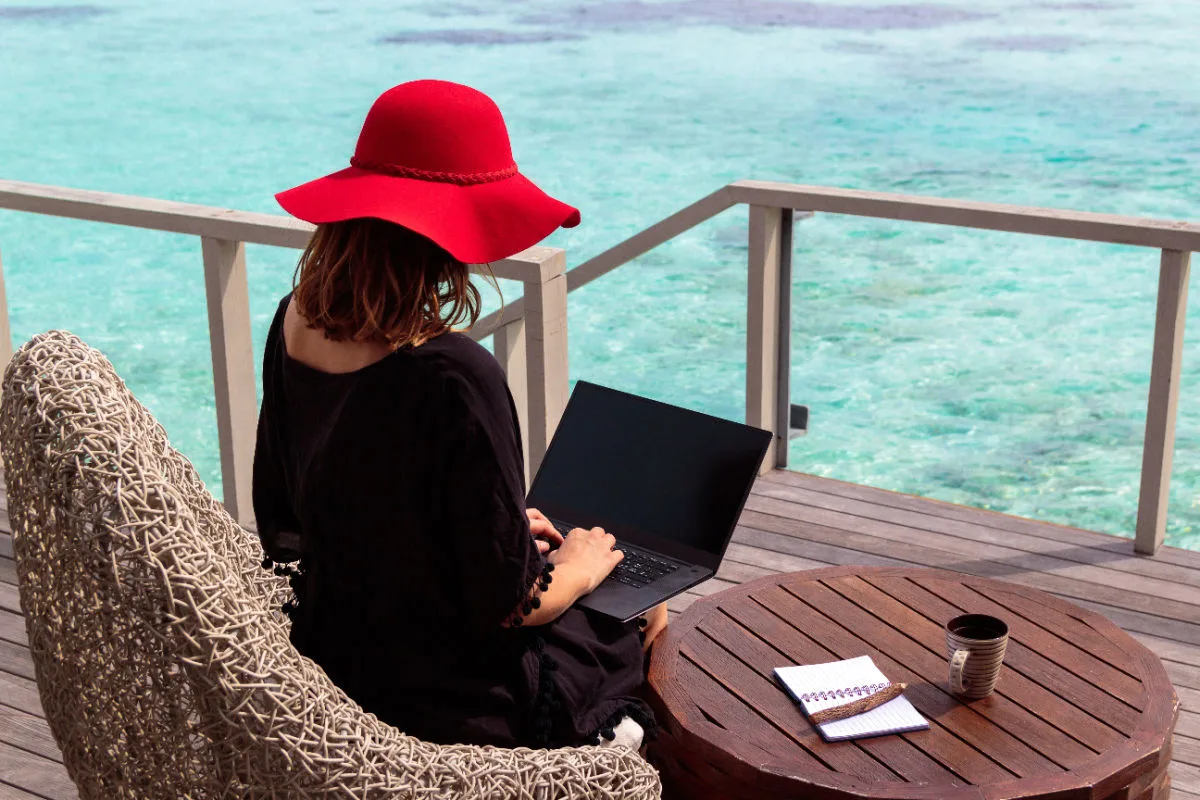 Digital Nomad Works on Laptop By Ocean in Bali.jpg