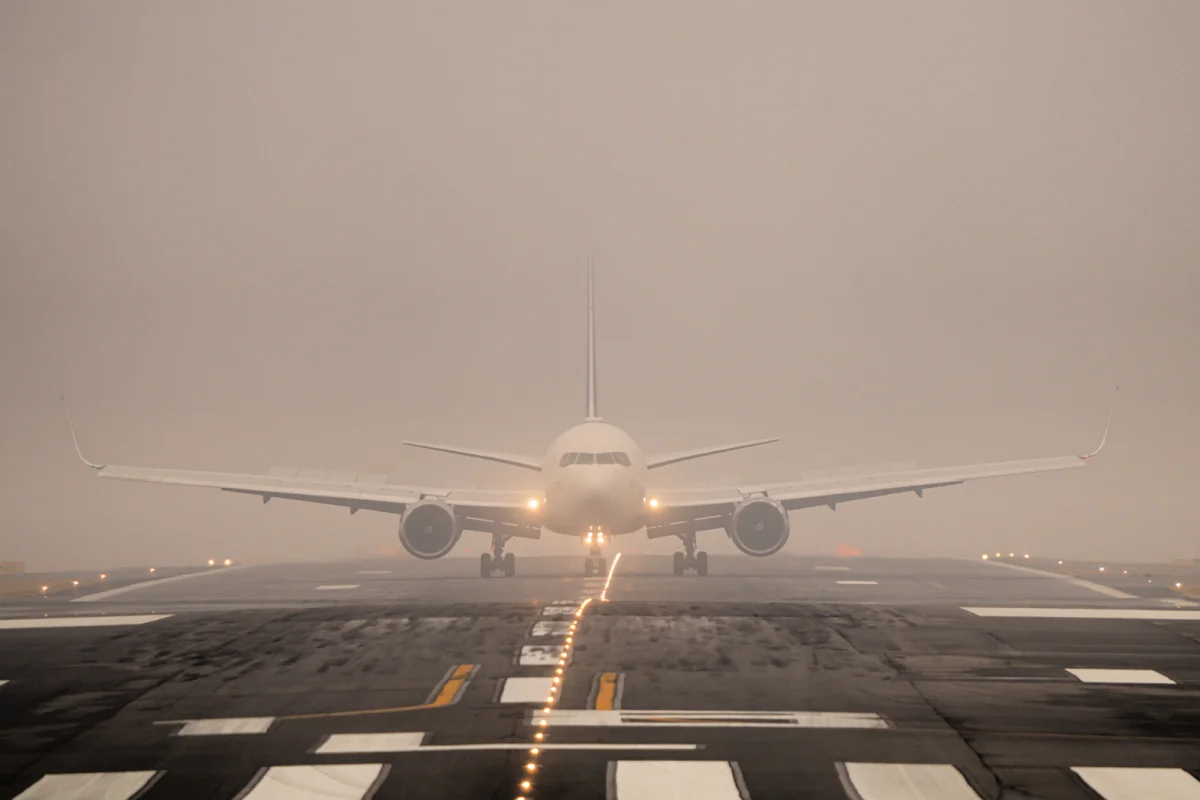 Plane Lands In Rain at Airport.jpg