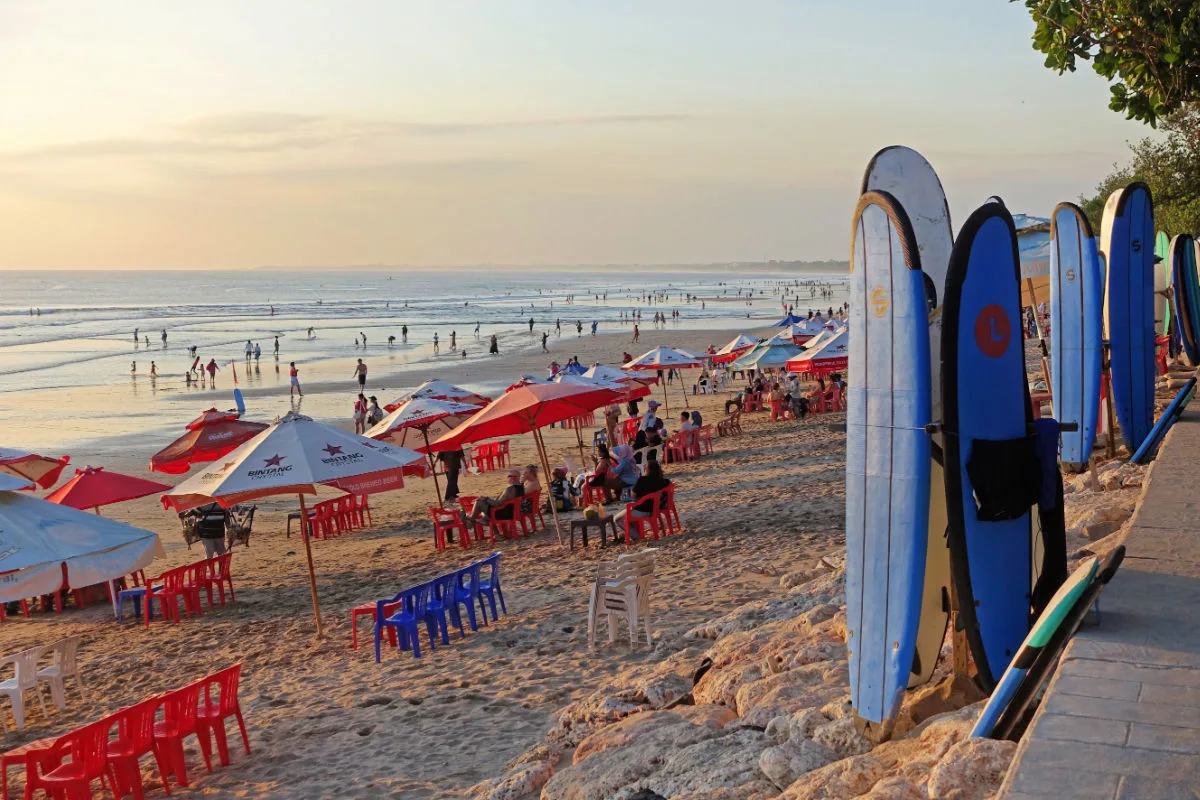 Kuta Beach in Bali With Surf Boards and Umbrellas.jpg