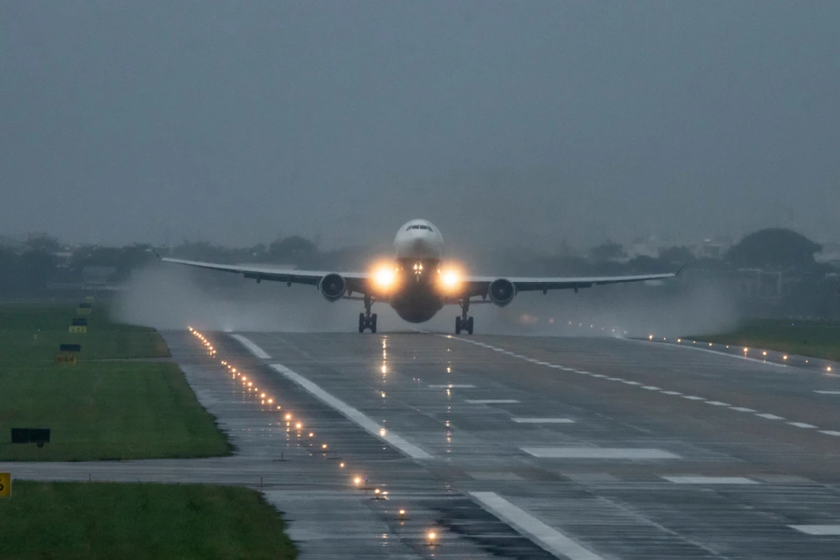 Plane in Rain on Runway.jpg