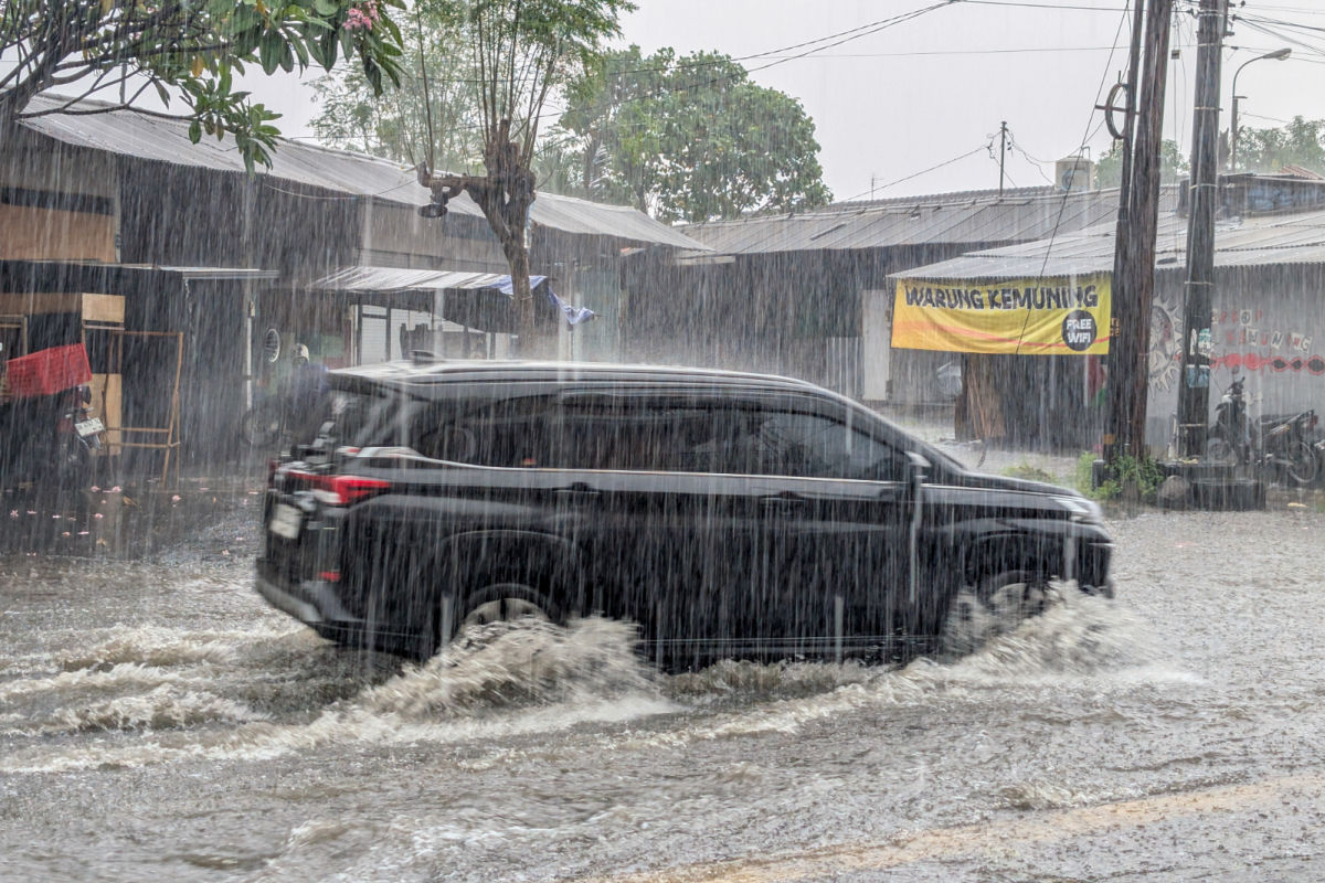 Car Drives In Heavy Rain Flooding Extreme Wether in Bali.jpg