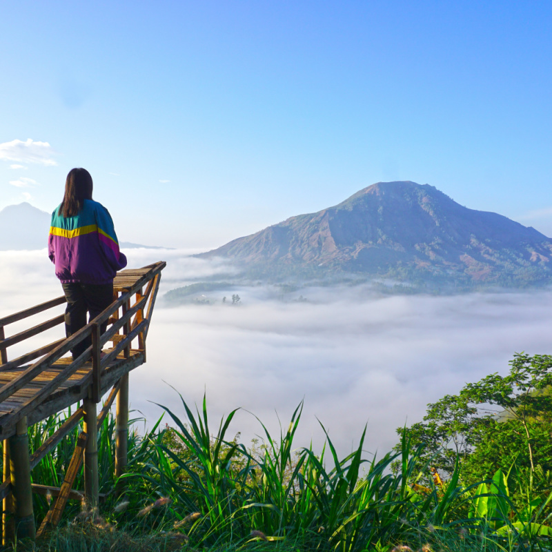 Tourist Looks From Kintamani View Point in Bali at Moount Batur