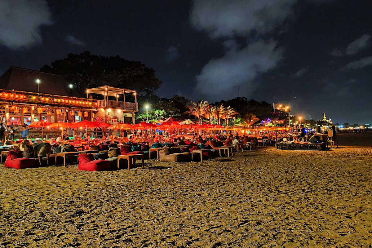 View of tourists at beach restaurant at night in Bali.jpg