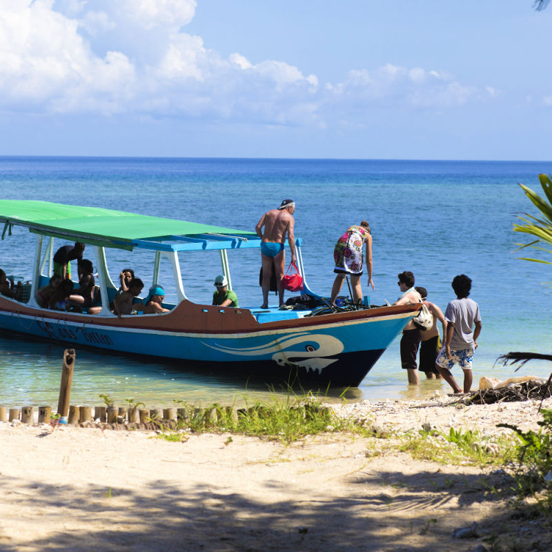 View of Touritsts Getting Off Boat on Bali Island