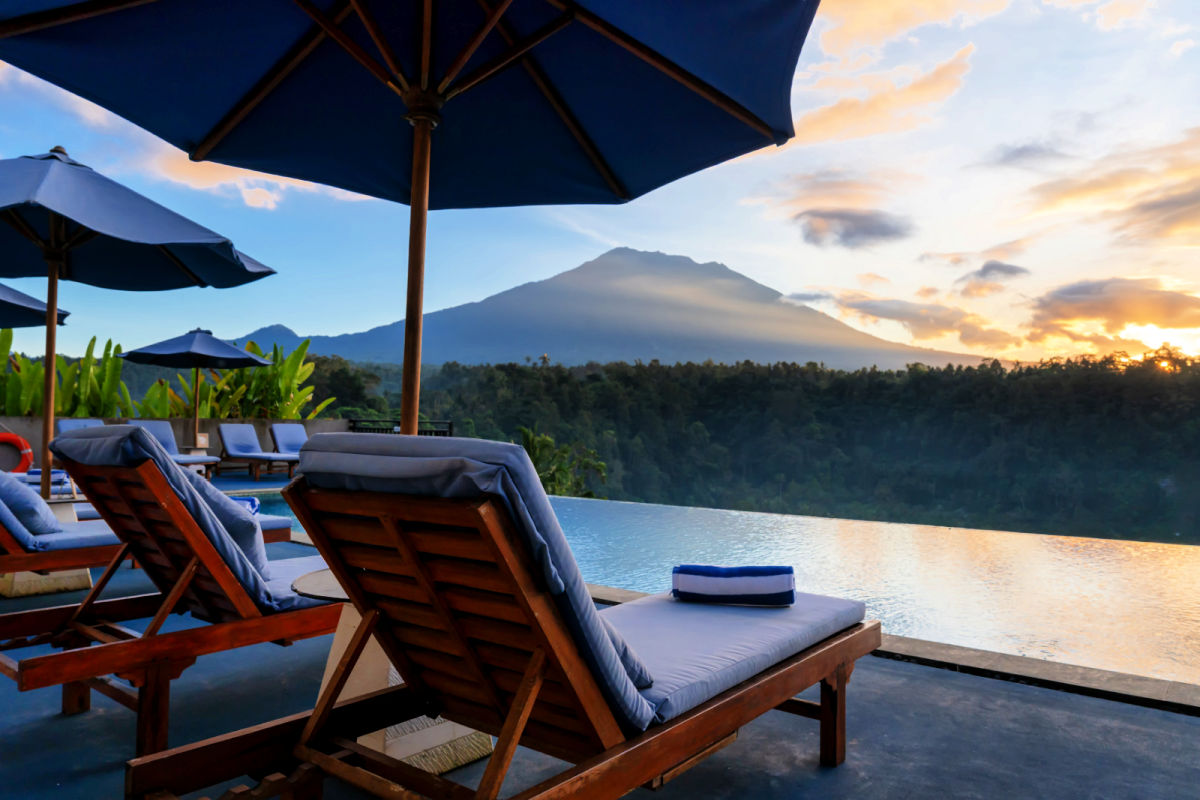 View of Pool and Sun Loungers and Mount Agung in Bali.jpg