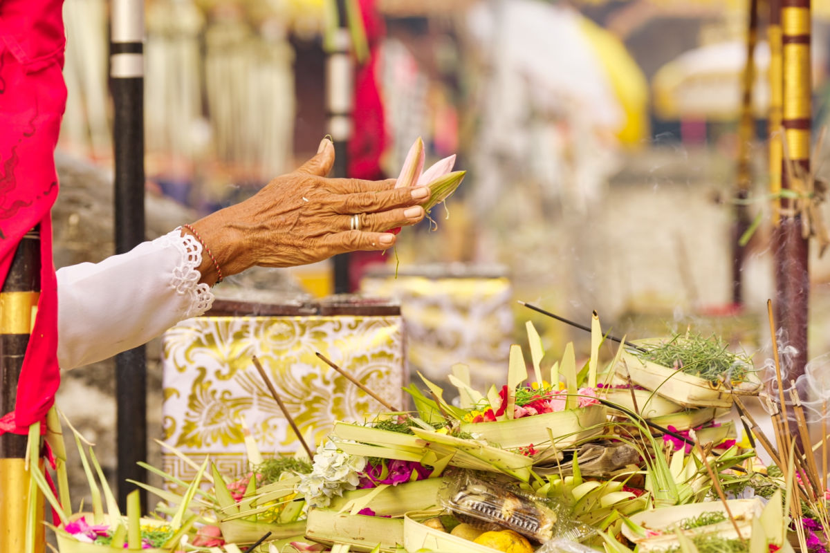 Woman Prays at Bali Ceremony.jpg
