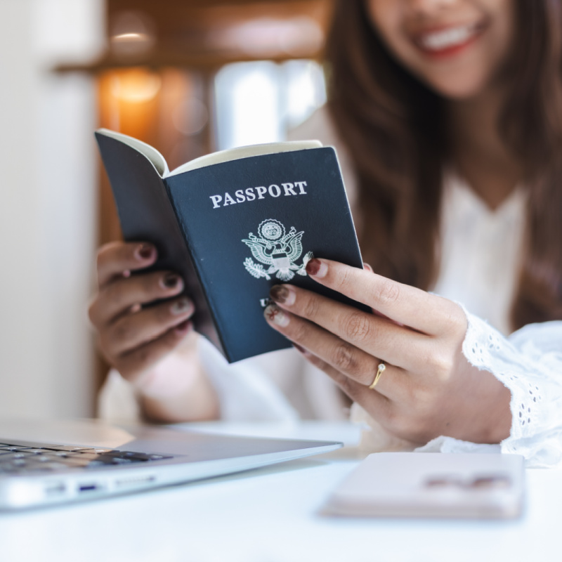 Woman with passport and laptop.jpg